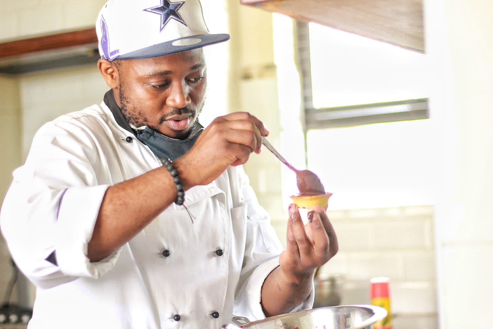 Chef preparing a dish in the kitchen